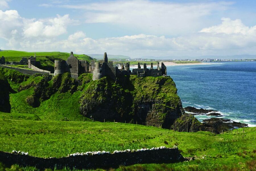 Dublin: Giant's Causeway, Dark Hedges & Titanic Guided Tour - Dunluce Castle ruins, the quick cliff-edge photo stop you should plan for